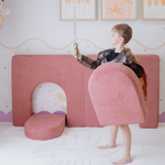 Possum Play Tunnels & Shields in Hibiscus — boy in a knight costume using the foam arch cushion as a shield