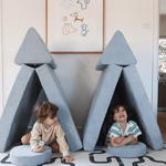 Two young children playing together in Possum Play Couch in Iceberg Light Blue - screen free imaginative playtime