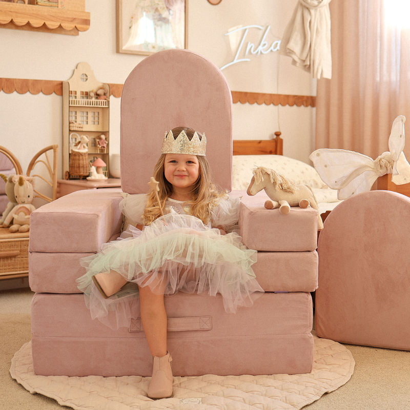 Possum Play Tunnels & Shields in Lilac — little girl in a princess dress sitting on a foam arch throne build