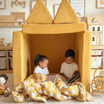 Two sibling children sitting inside a Possum Play Couch in Sunshine Yellow reading and having quiet and screen free play time